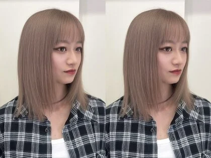 顔まわりにレイヤーを入れた女性のミディアムヘア